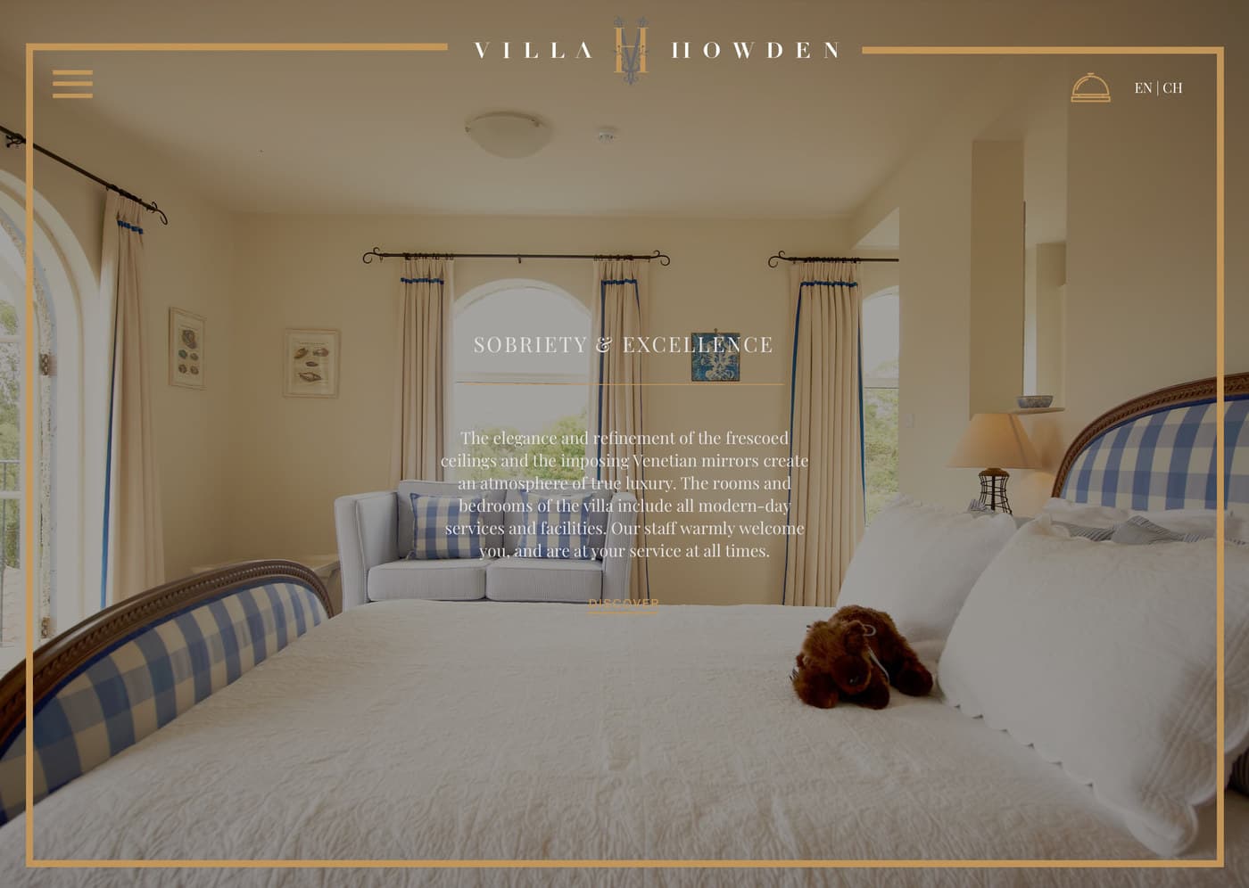 The accommodation page: a photograph of a room with blue striped chairs and a made bed, headed 'Sobriety and Excellence'.